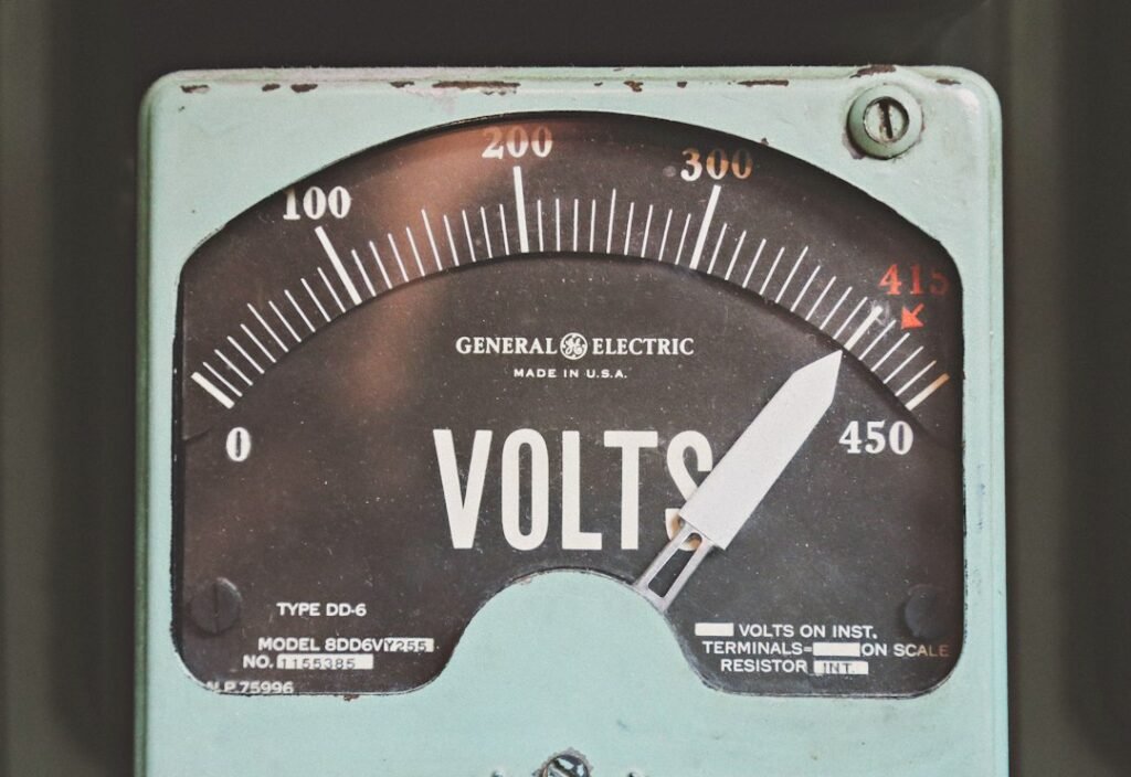 Electrical volt meter illustrating voltage and power measurements used in UPS sizing